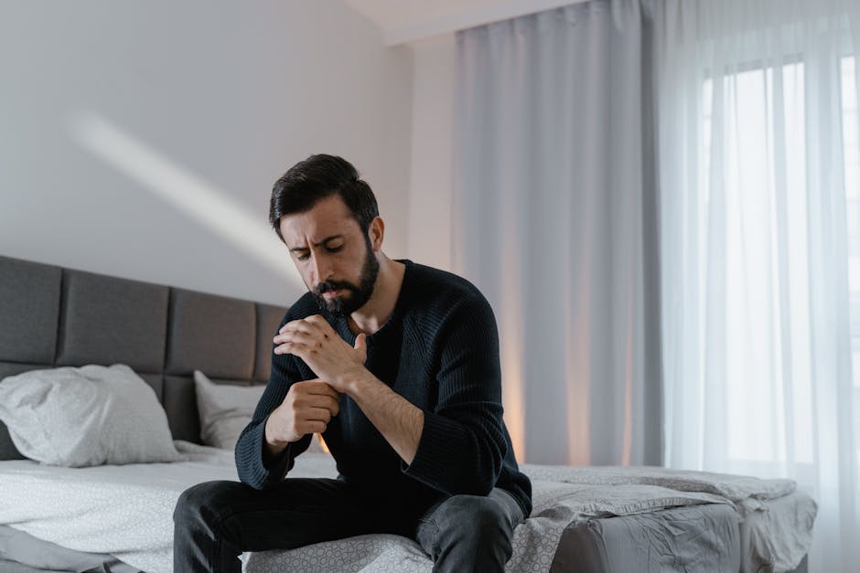 A person enjoying an unhurried morning with coffee by the window