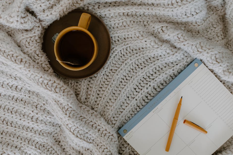 A peaceful morning desk setup with tea and warm natural light