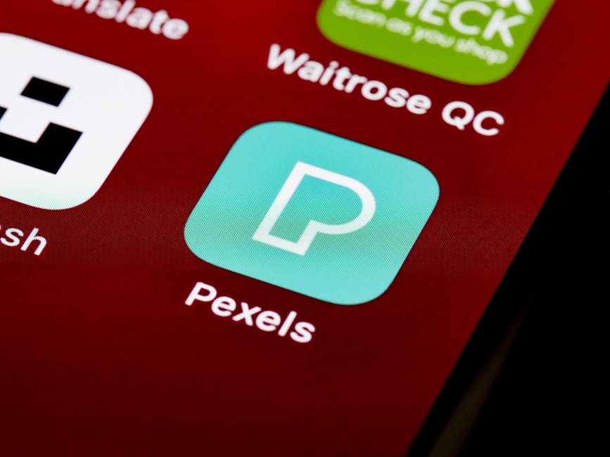 A clean iPhone home screen with minimal apps visible on a light background