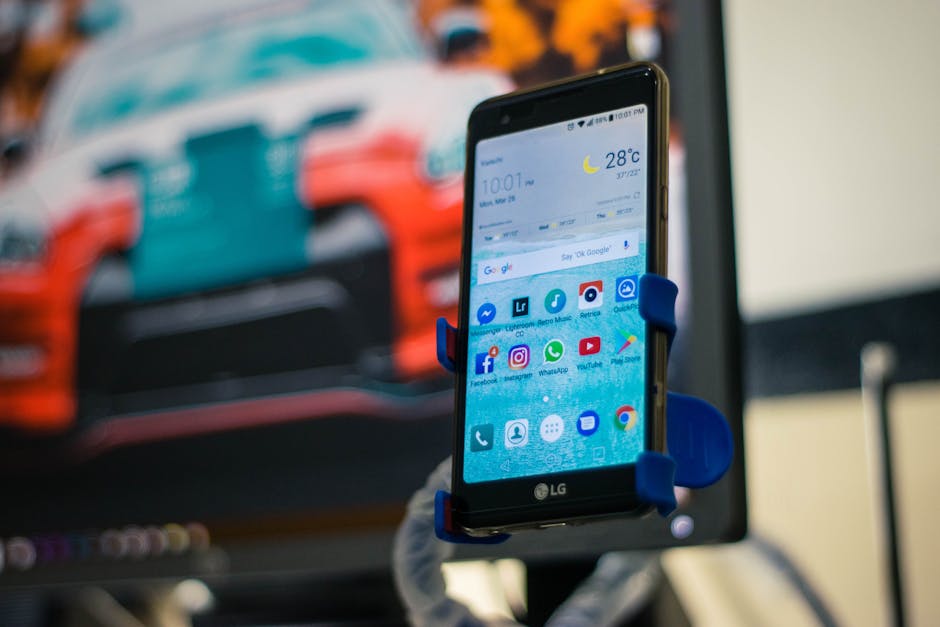 A phone sitting on a wooden surface showing a calm, minimal home screen with a calendar widget in soft daylight