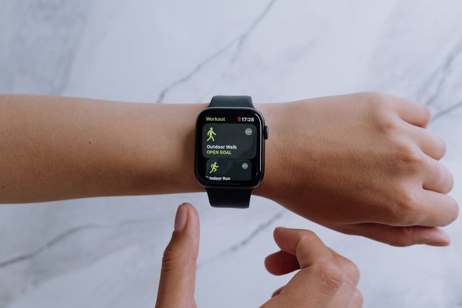 A wrist with an Apple Watch catching sunlight, person gesturing while speaking