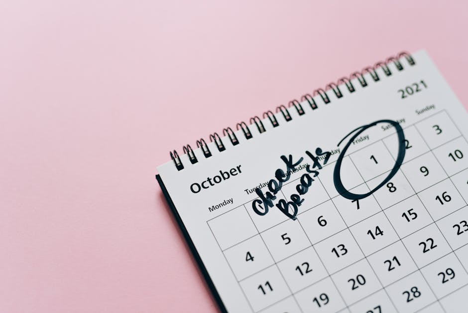 A person checking their calendar on their phone while walking through the city