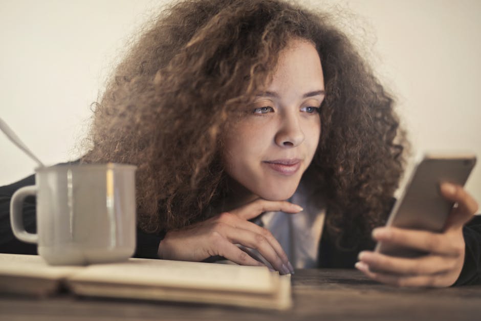 A person checking their phone during a calm midday break