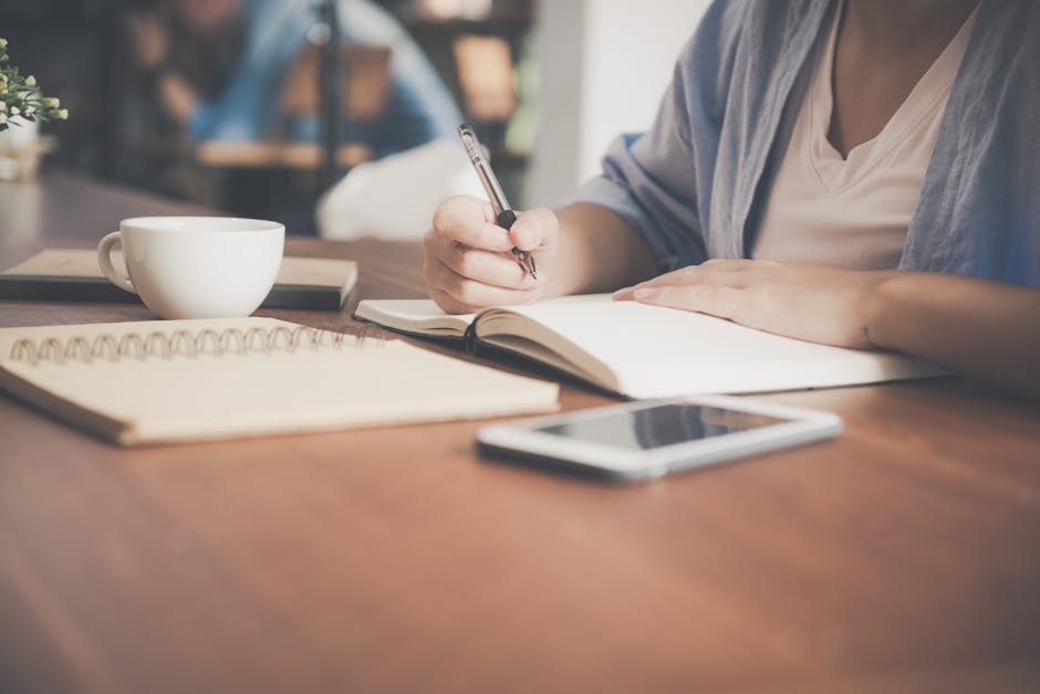 A person focused on their work at a minimalist, calm desk